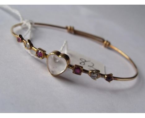 Gold bangle set with a heart shaped moonstone to  centre and flanked either side with rubies and   diamonds  7.7g inc       