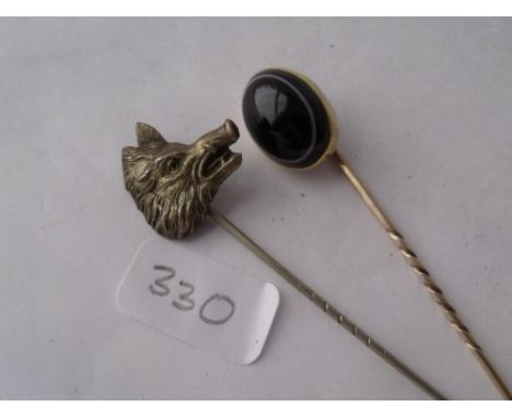 A banded agate stick pin and another with Boars head  