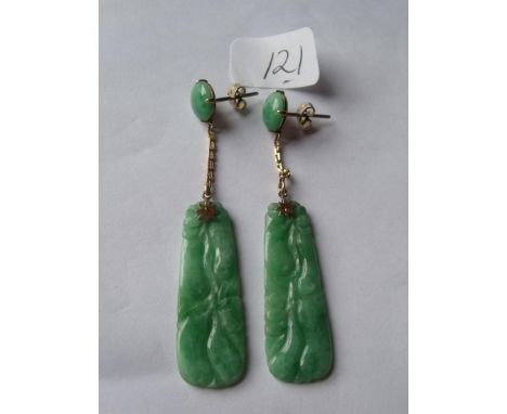 A pair of carved gold mounted jade drop earrings 5cm long        