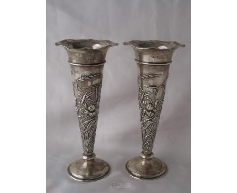 A good pair tall art nouveau trumpet shaped candle   sticks embossed with iris 8” high Lon 1901 by WC   