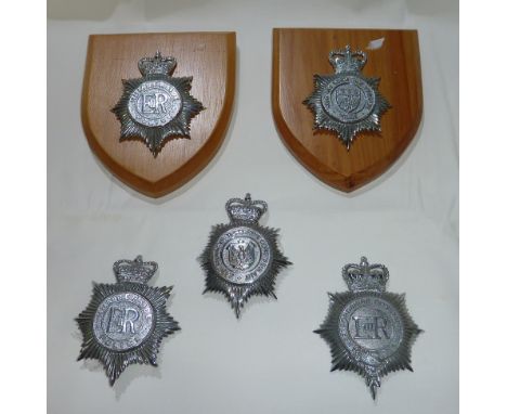 Two mounted police helmet badges including Humberside Police, York and North East Yorkshire Police and three loose ERII helme