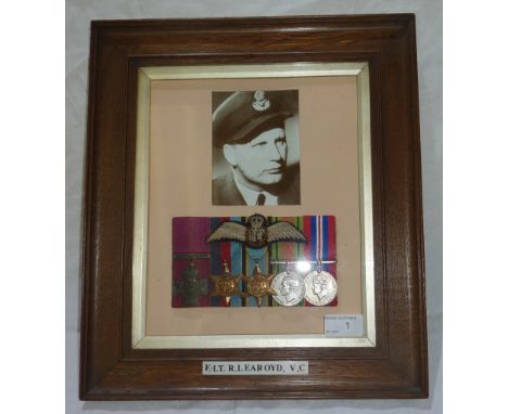 Oak framed mounted display with photographic prints, WWII group of medals for F- LT. R. Learoyd V.C, comprising of replica Vi