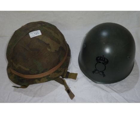 American Vietnam period helmet with liner and straps and camouflage cover