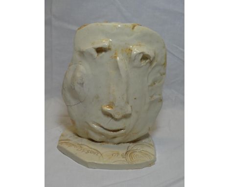 A ceramic sculpture of a head by Julian Dyson, insized signature and dated 09.00, 8" high