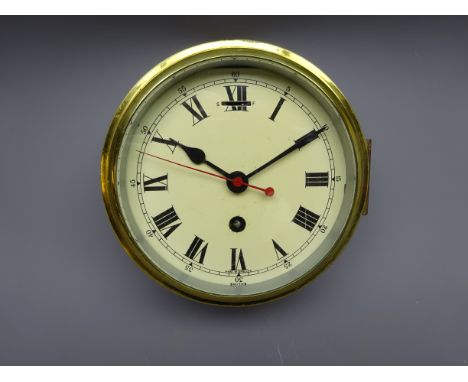 Smiths brass cased Ship's bulkhead clock, cream Roman dial with black hand and red sweep seconds, single train Astral movemen