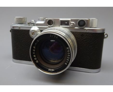 Leica 35mm film camera, Ernst Leitz Wetzlar D.R.P. No.148432, with Jupiter -8 2/50 lens No.6082014 with lens cover, in leathe