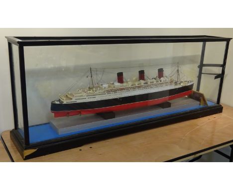 Large scale model of RMS Queen Mary, painted paper and card on frame, black above and red below water line, on rectangular pl