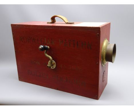 Norwegian Pattern rotary fog horn, red painted plywood body with paper label to the top, side crank handle operating the inte