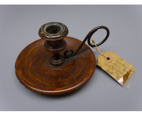 19th century turned wooden chamber candlestick made from the oak of The Royal George, with metal loop handle and sconce, W14c