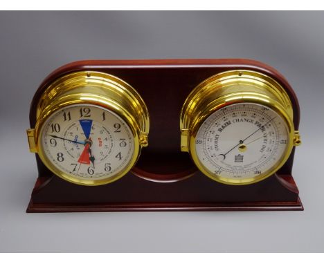 Sewills Precision Aneroid barometer and a similar Tide Clock, both in bulkhead type cases, on a shaped wooden wall plaque, W4