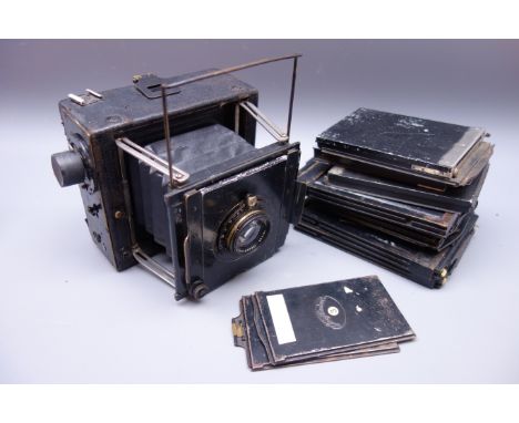 Graflex folding camera with Ross 136mm xpress F.4.5 lens No. 133398 with various sized dark slides