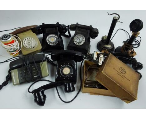 Two black bakelite turn-dial telephones, part candlestick telephone, candlestick type telephone speaker, two other turn-dial 