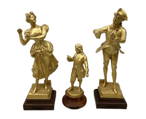 After J. Lavergne, pair of gilt painted spelter figures of a Dandy and his lady, each titled 'Propos Galant' on wooden base H