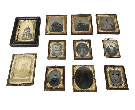 Eleven 19th Century portrait tintypes, housed in ornately detailed gilt metal frames and mounts with apertures of various sha