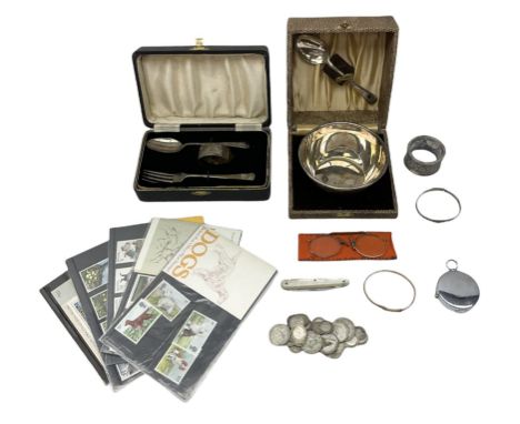 Cased silver three piece christening set, comprising fork, spoon and napkin rings, hallmarked Birmingham, together with a sil