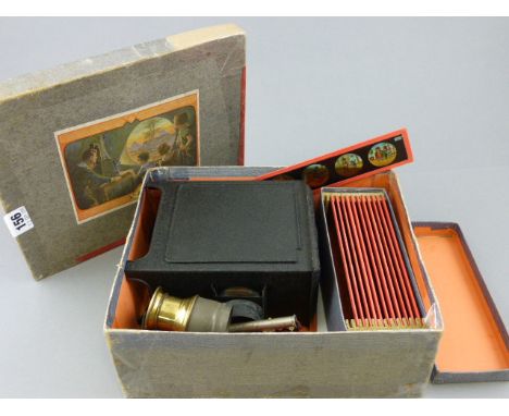 Boxed Child's Magic Lantern with various Slides, made in Germany