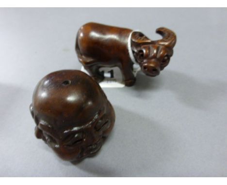 Signed Wood Netsuke of a Money Cow plus a wood Netsuke of a Four Faces of Buddha