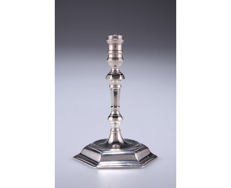 A GEORGE II SILVER TAPER STICKLondon 1745Waisted sconce above a knopped and faceted stem issuing from a hexagonal base, maker