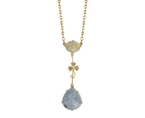 AN EDWARDIAN OPAL AND DIAMOND PENDANTThe oval cut opal claw set on an articulated link to the bottom of a knife edge bar with