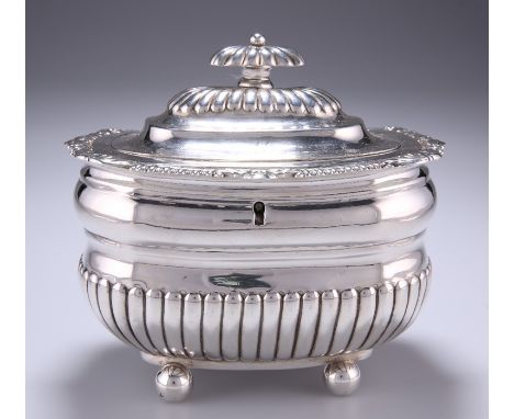 A GEORGE III SILVER TEA CADDYby J.W. Story and & W. Elliott, London 1811Rounded rectangular form, part-fluted decoration, flu