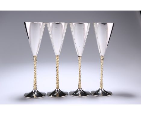 A SET OF FOUR ELIZABETH II PARCEL-GILT SILVER CHAMPAGNE FLUTESby Stuart Devlin, London 1979 and 1980Each conical bowl raised 