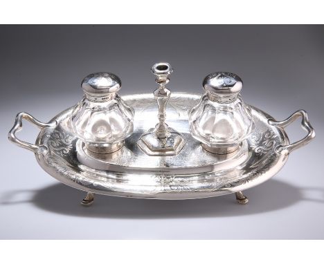 A VICTORIAN SILVER INKSTAND WITH TAPER STICK by Henry Wilkinson & Co, London 1857Oval with twin scroll handles, engraved with