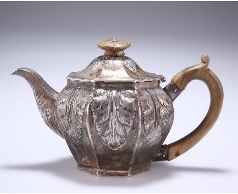 A GEORGE III SILVER TEAPOTmaker TH, London 1806Hexagonal with larges chased leaves to the sides, cover and spout.11cm high. 9