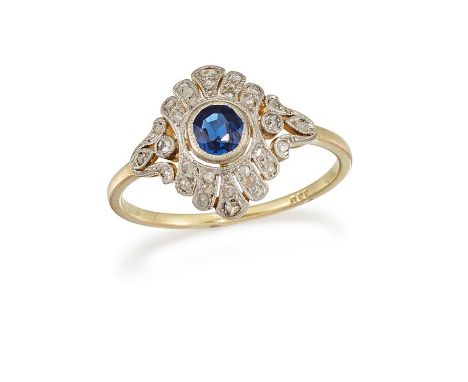 A SAPPHIRE AND DIAMOND RINGThe collet-set sapphire, within an openwork surround of rose-cut diamonds, between similarly-set s