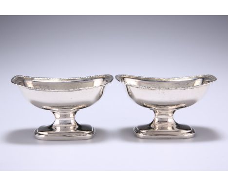 A PAIR OF IRISH SILVER SALTSby James Scott, Dublin 1805Rounded rectangular form with gadrooned borders.5.5cm high, 9.7cm long