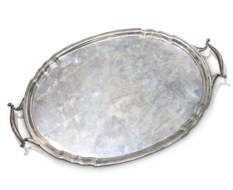 A LARGE GEORGE V SILVER TRAYby G & S, Sheffield 1929Oval with two scroll handles and shaped edge, presentation inscription to