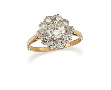 A DIAMOND CLUSTER RINGThe principal brilliant-cut diamond, within a similarly-cut surround, accented by baguette-cut diamonds