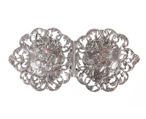 A LATE VICTORIAN SILVER BELT BUCKLEby Horton & Allday, London 1896Each section chased with the heads of putti within a scroll