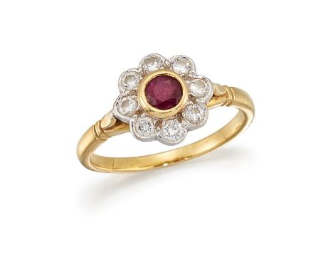 A RUBY AND DIAMOND CLUSTER RINGThe collet-set circular-cut ruby, within a floraform cluster of brilliant-cut diamonds, betwee