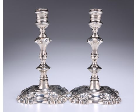 A PAIR OF GEORGE II SILVER CANDLESTICKSby Mary Gould (Mrs James Gould), London 1747Each with waisted reeded socket over a kno