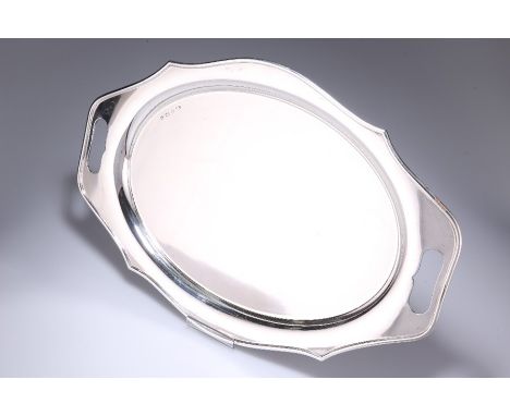 A LARGE GEORGE V SILVER TRAYby Emil Viner, Sheffield 1932Shaped oval form with cut-out handles.50.5cm long, 34.3cm wide. 53.5