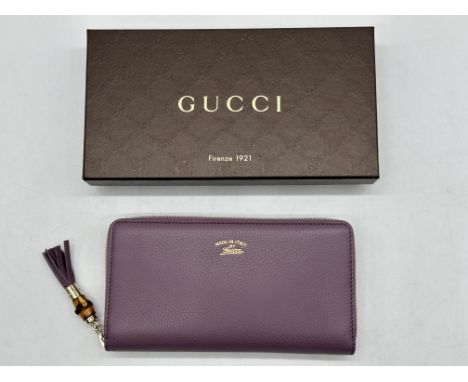 Gucci Purple Leather Bamboo Tassel Zip Around Wallet, Boxed. 
Excellent Condition, as new, flawless inside and out. 