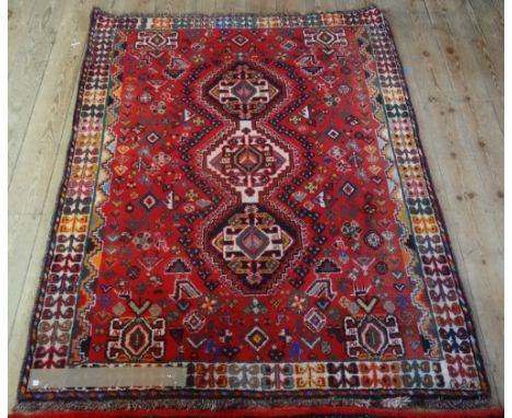 An Iranian hand made Kashgai carpet, 100% wool pile (157cm x 128cm).