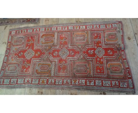 A Turkish-style carpet (168cm x 104cm).