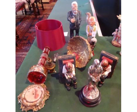 A Bohemian ruby glass lamp base (in need of restoration), together with a pair of blackamoor bookends, a plaster model of the