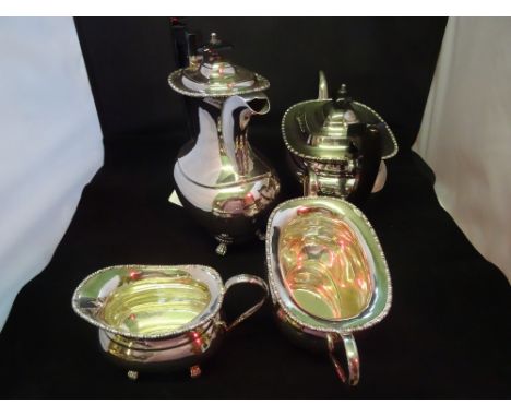 A four piece silver plated tea set, to include: teapot, water jug, a twin handled sugar bowl and a cream jug, all on four paw