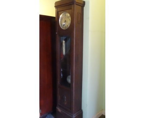 A 1930's oak triple weight Vienna chiming longcase clock, the silvered dial bearing Arabic numerals (213cm).