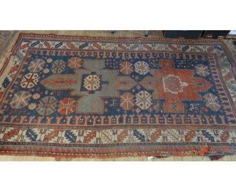 An Eastern rectangular carpet (230cm x 130cm).