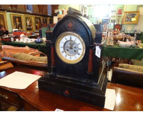 An imposing Gothic revival slate mantle clock, the eight day striking movement numbered 2558, the case inlaid with red marble