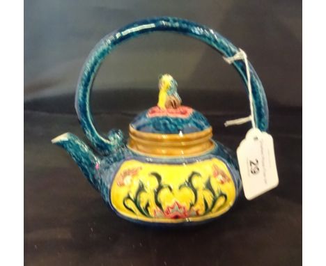 A Taiwan-Cochin ceramic teapot, an elaborately decorated in the Majolica style, the cover having Dog of Fo finial (14cm).