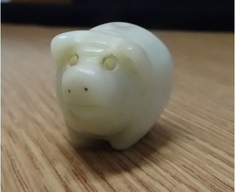 A mutton fat jade carved pig (3.5cm long).