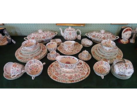 A Minton Haddon Hall part-dinner service, comprising two tureens, teapot, cups and saucers, soup bowls, graduated oval dishes