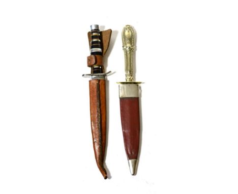 A Victorian Prostitute's Dagger, the 11.5cm double edge steel blade with raised medial ridge to each side, the German silver 