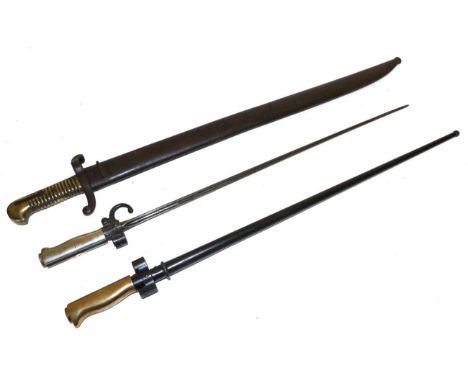 A French M1842 Sabre Bayonet, with steel recurving crossguard, brass hilt and steel scabbard; a French M1886 Epee Bayonet, wi