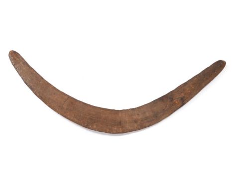 An Early 19th Century Australian Aboriginal War Boomerang, of unusual wide design with slightly ribbed surface, 69cm, possibl