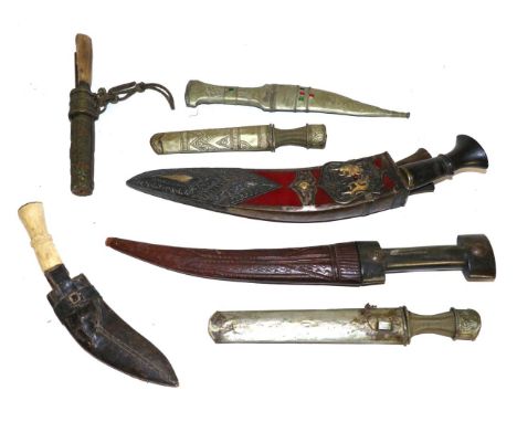 A Nepalese Presentation Horn-Handled Kukri, the velvet-covered scabbard with repousse-decorated and gilded white metal mounts